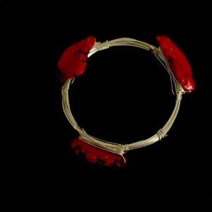 Silver bracelet with red stones.